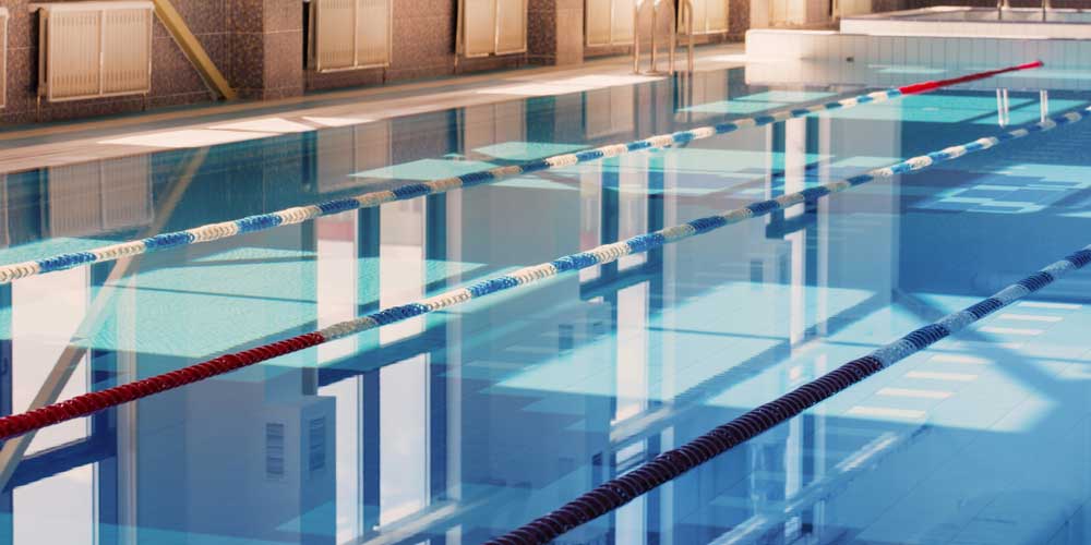 Why is it recommended to use SDIC for swimming pool disinfection?